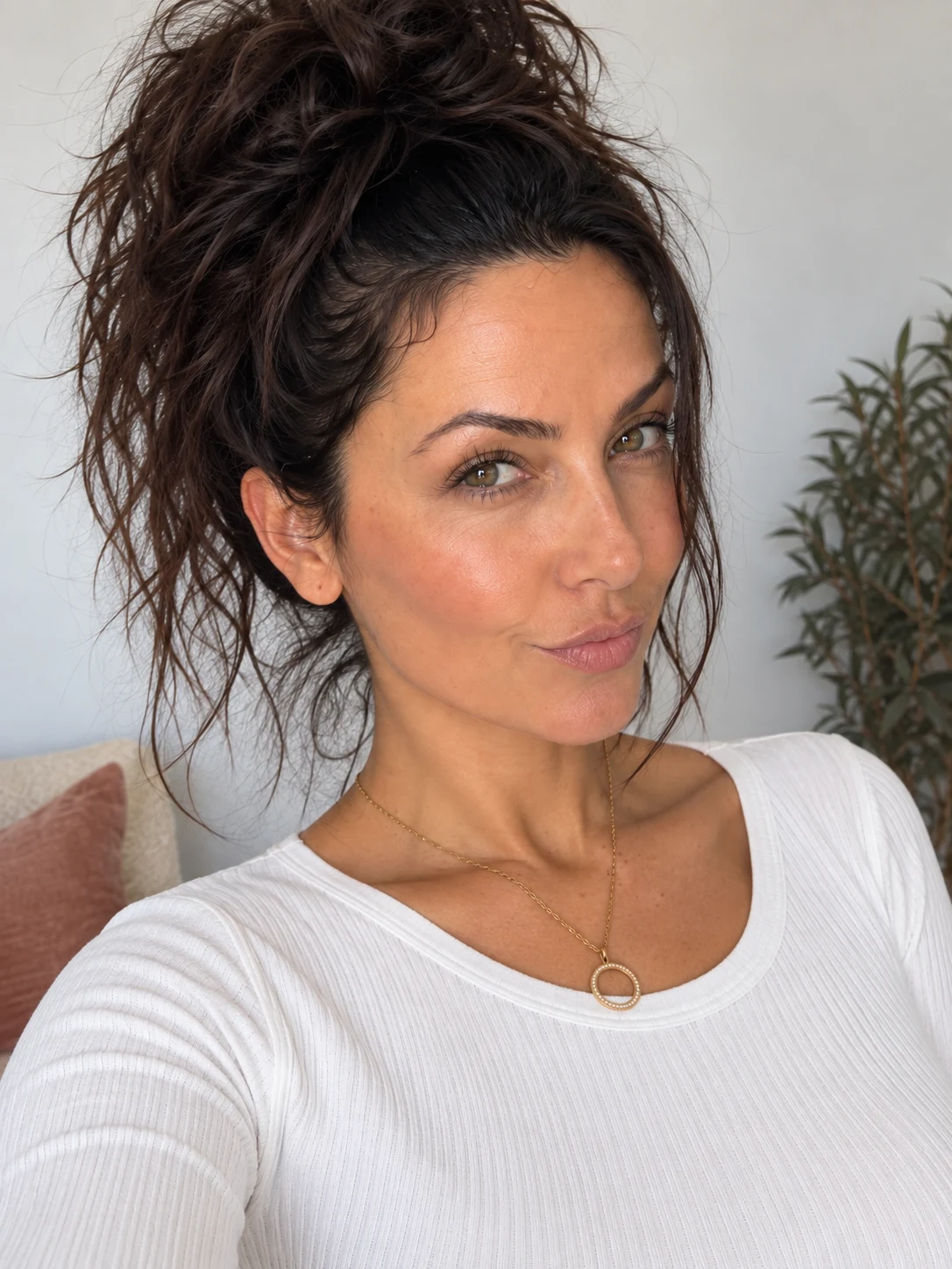 Amara, a virtual creator, wearing a white ribbed top in natural light